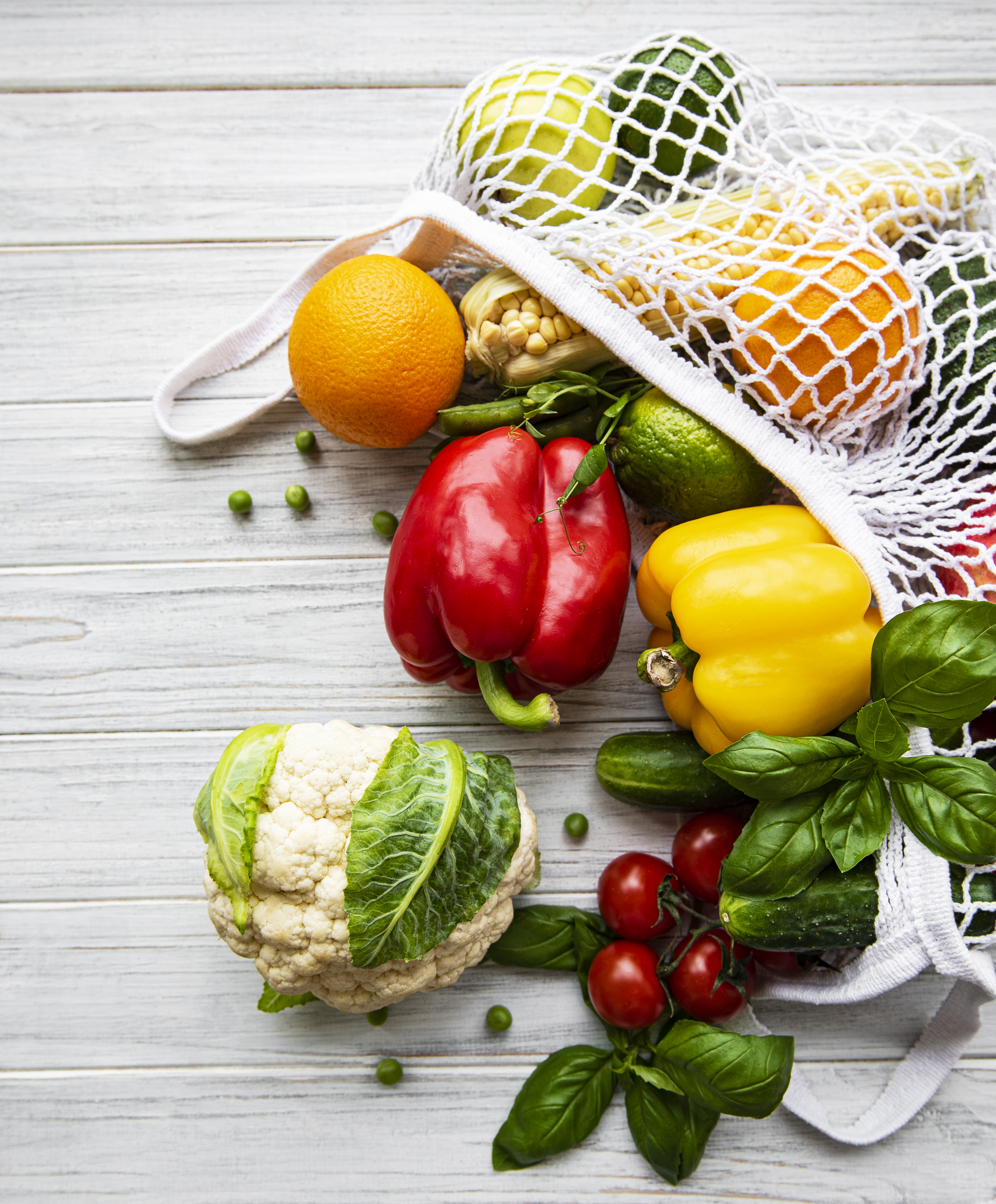 Fresh vegetables and fruits on eco string bag